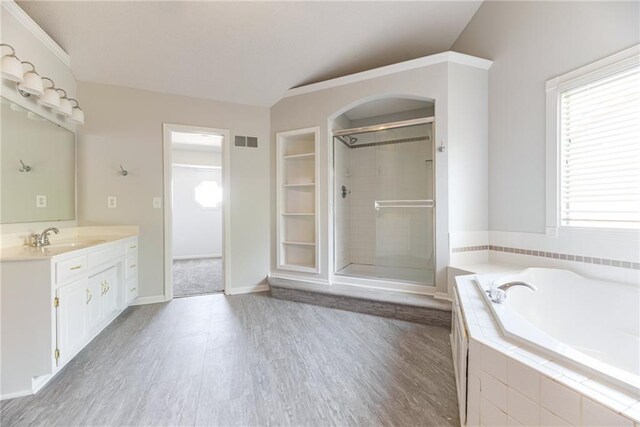 6402 W 147th Ter, Overland Park, KS 66223 - bathroom with plenty of natural light, a stall shower, a bath, and vanity