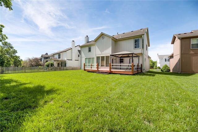 6402 W 147th Ter, Overland Park, KS 66223 - rear view of house featuring a chimney and a deck