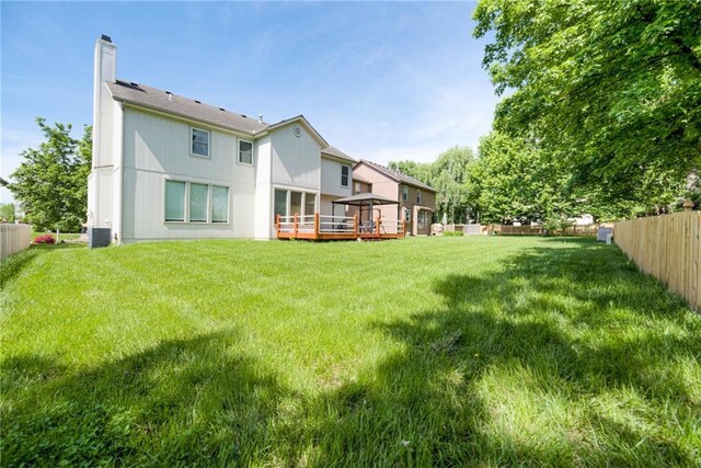 6402 W 147th Ter, Overland Park, KS 66223 - rear view of house with a gazebo, a chimney, a wooden deck, and cooling unit