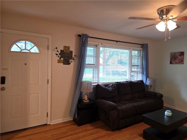 529 S Northern Blvd, Sugar Creek, MO 64054 - living room with healthy amount of natural light, light wood finished floors, and a ceiling fan