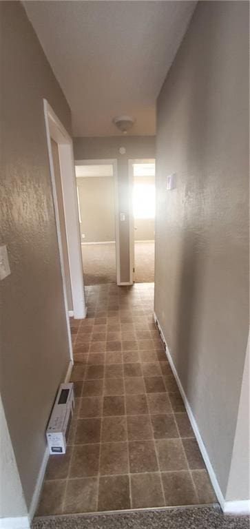 2219 E 75th St, Kansas City, MO 64132 - hallway featuring baseboards