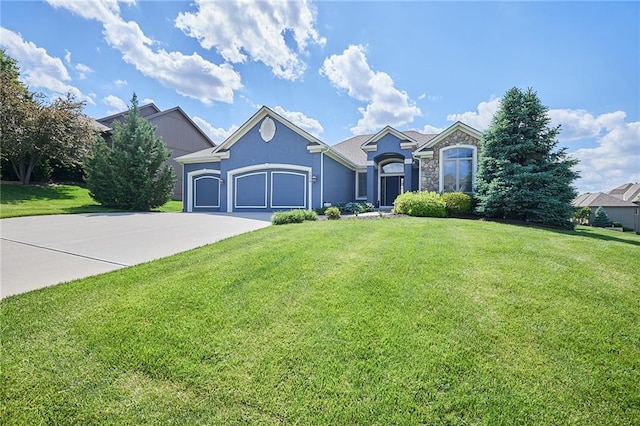 ranch-style house with stone siding, driveway, a front lawn, an attached garage, and stucco siding