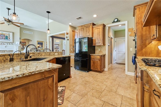 kitchen featuring black appliances, a sink, brown cabinets, ceiling fan, and recessed lighting