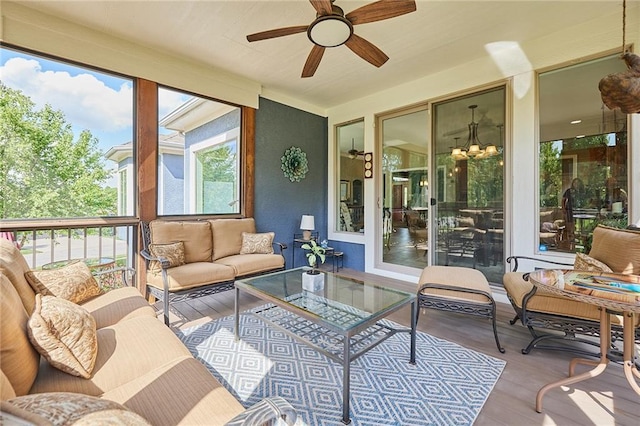 sunroom / solarium featuring wood finished floors