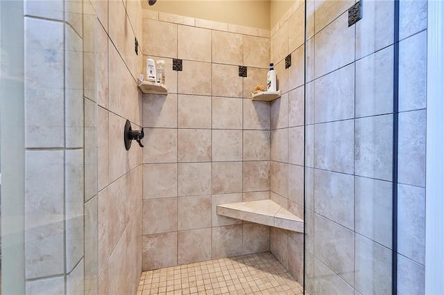 bathroom featuring a tile shower