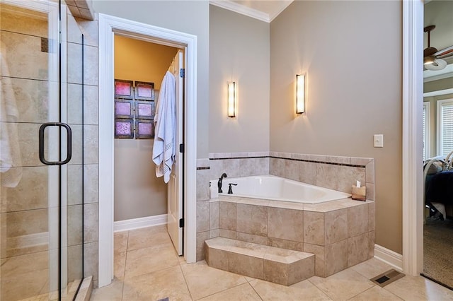 ensuite bathroom featuring crown molding, a stall shower, baseboards, and a bath