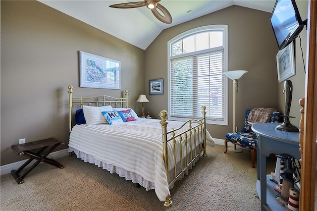 bedroom with vaulted ceiling, light colored carpet, baseboards, and ceiling fan