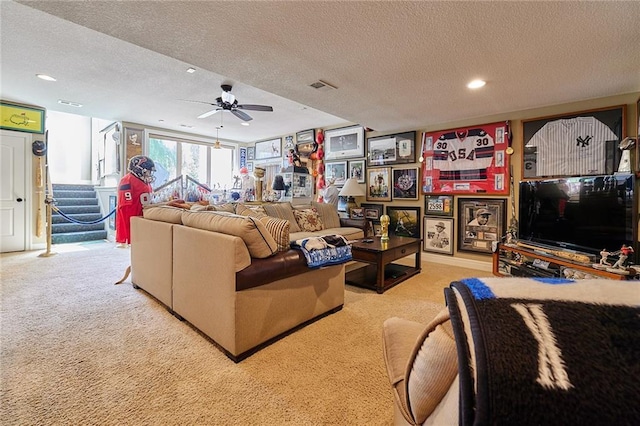 carpeted living room with a textured ceiling, stairway, a ceiling fan, and recessed lighting