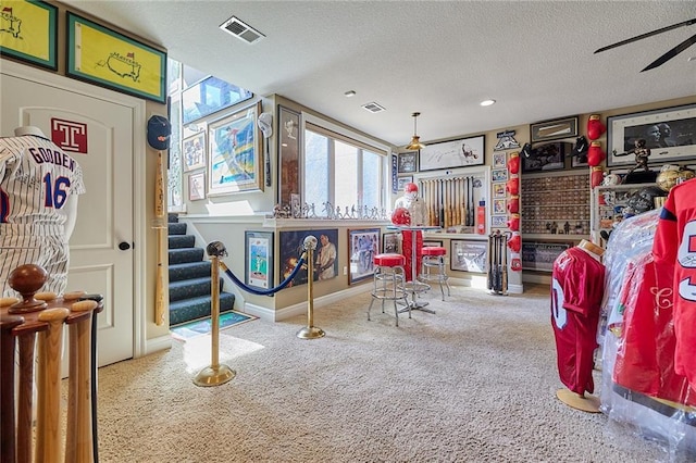 playroom with carpet flooring, a textured ceiling, baseboards, recessed lighting, and ceiling fan