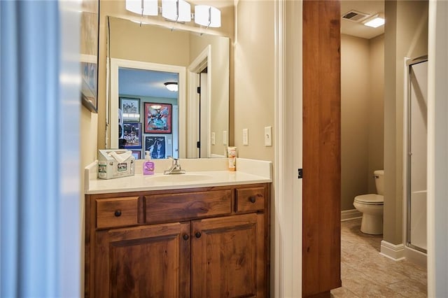 full bath featuring a shower stall, toilet, vanity, and tile patterned flooring