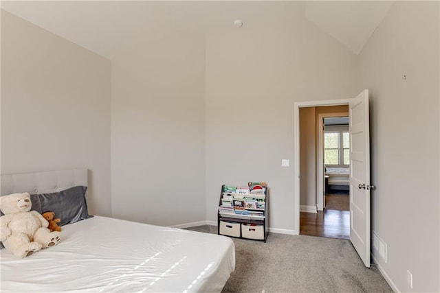 16200 Stearns St, Overland Park, KS 66221 - carpeted bedroom featuring vaulted ceiling and baseboards