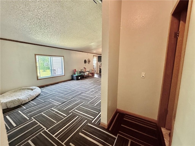 carpeted bedroom featuring a textured ceiling