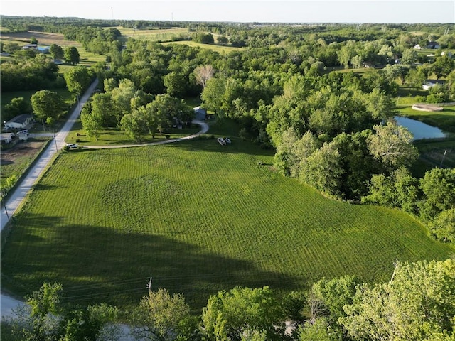 aerial view of property's location featuring rural landscape and a large body of water