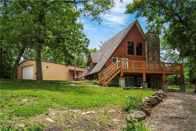 429 SE Lakeside Dr, Lacygne, KS 66040 - back of house featuring a chimney, a deck, a garage, and a yard