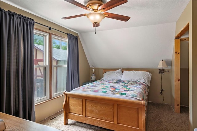429 SE Lakeside Dr, Lacygne, KS 66040 - carpeted bedroom featuring vaulted ceiling and ceiling fan