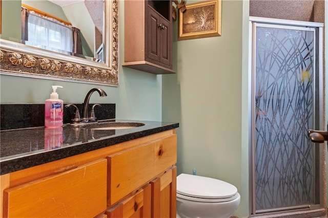 429 SE Lakeside Dr, Lacygne, KS 66040 - bathroom featuring a shower stall, toilet, and vanity