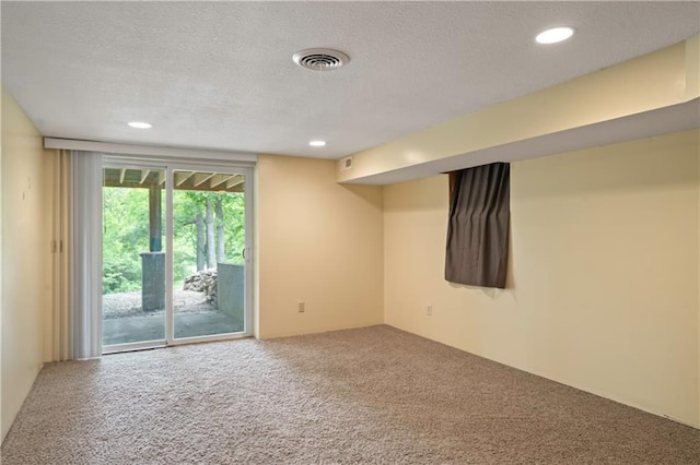 429 SE Lakeside Dr, Lacygne, KS 66040 - carpeted empty room featuring a textured ceiling and recessed lighting