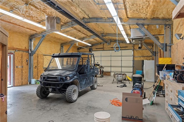 429 SE Lakeside Dr, Lacygne, KS 66040 - garage featuring freestanding refrigerator