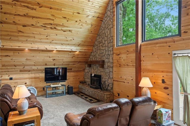 429 SE Lakeside Dr, Lacygne, KS 66040 - living room with wooden walls, a wood stove, carpet flooring, wood ceiling, and vaulted ceiling