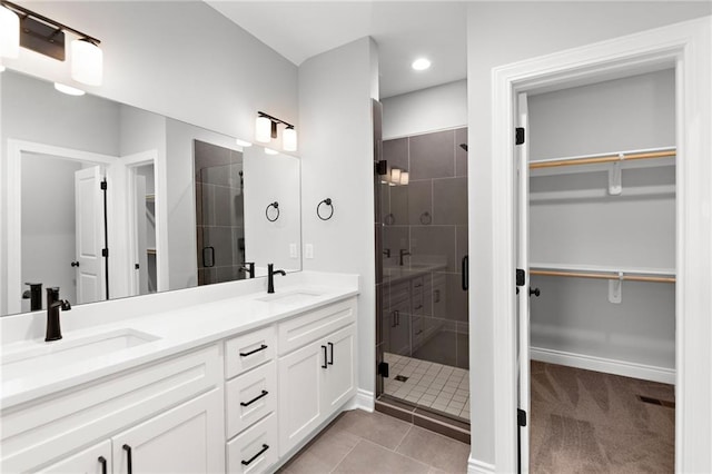 522 NW 110th St, Kansas City, MO 64155 - bathroom with a stall shower, a spacious closet, double vanity, tile patterned flooring, and recessed lighting