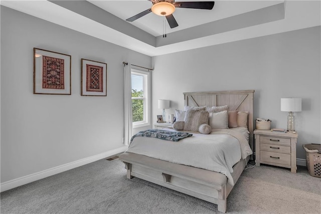 522 NW 110th St, Kansas City, MO 64155 - bedroom featuring light colored carpet, baseboards, a raised ceiling, and a ceiling fan