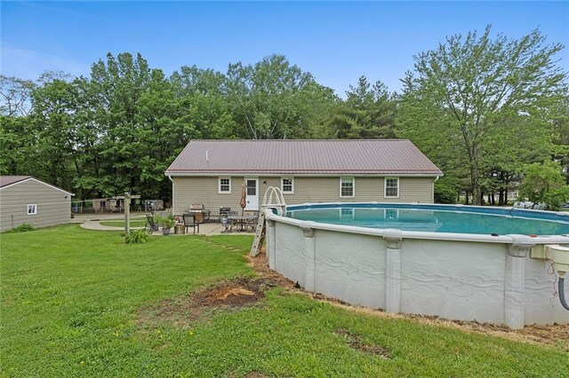 336 SE Zack Wheat Dr, Polo, MO 64671 - swimming pool with a yard, a patio area, and a grill