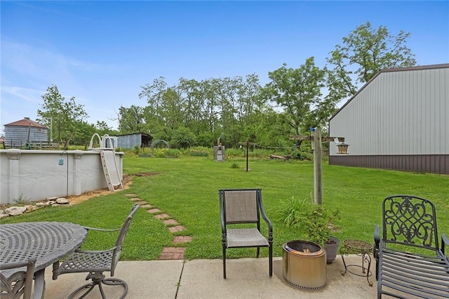 336 SE Zack Wheat Dr, Polo, MO 64671 - view of green lawn featuring a patio area and an outdoor pool