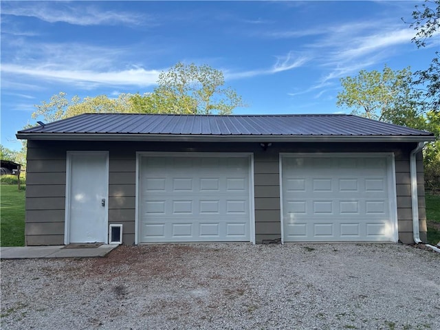 336 SE Zack Wheat Dr, Polo, MO 64671 - garage with gravel driveway