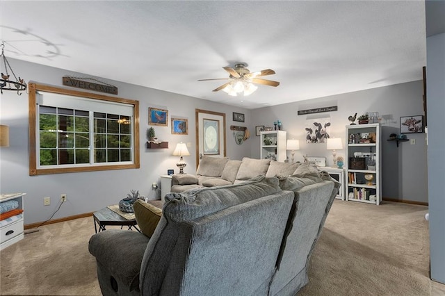 336 SE Zack Wheat Dr, Polo, MO 64671 - living area featuring carpet, ceiling fan, and baseboards