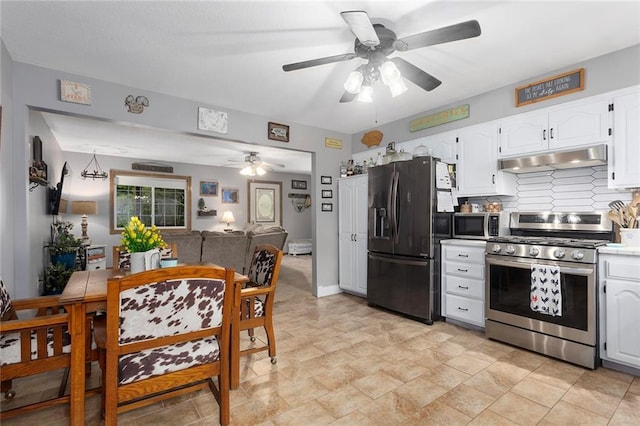 336 SE Zack Wheat Dr, Polo, MO 64671 - kitchen with appliances with stainless steel finishes, under cabinet range hood, ceiling fan, backsplash, and white cabinetry