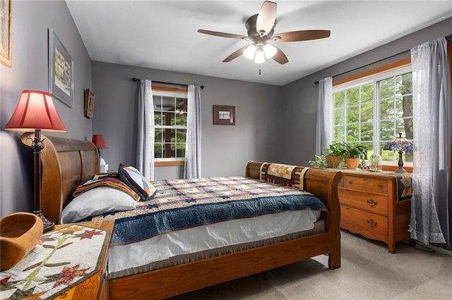 336 SE Zack Wheat Dr, Polo, MO 64671 - bedroom with light carpet and a ceiling fan