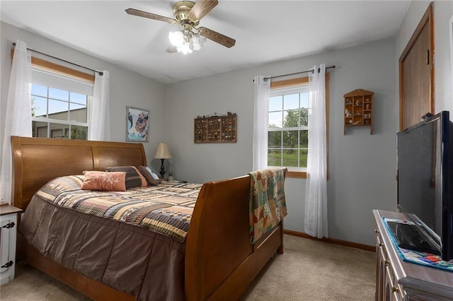 336 SE Zack Wheat Dr, Polo, MO 64671 - bedroom with light colored carpet, baseboards, and ceiling fan