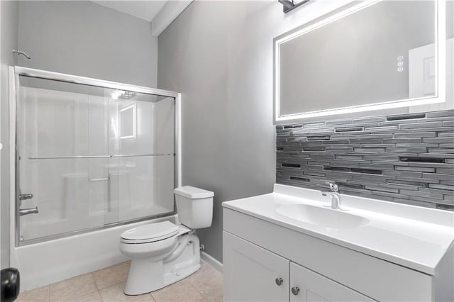 4612 Roberts St, Shawnee, KS 66226 - full bathroom featuring tasteful backsplash, vanity, bath / shower combo with glass door, and tile patterned floors
