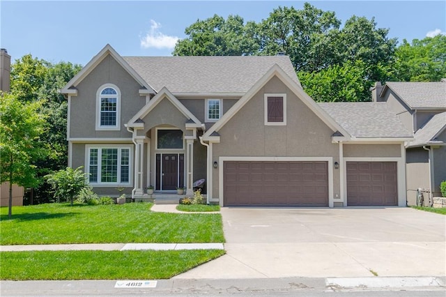 4612 Roberts St, Shawnee, KS 66226 - view of front of property with stucco siding, concrete driveway, a front yard, and roof with shingles