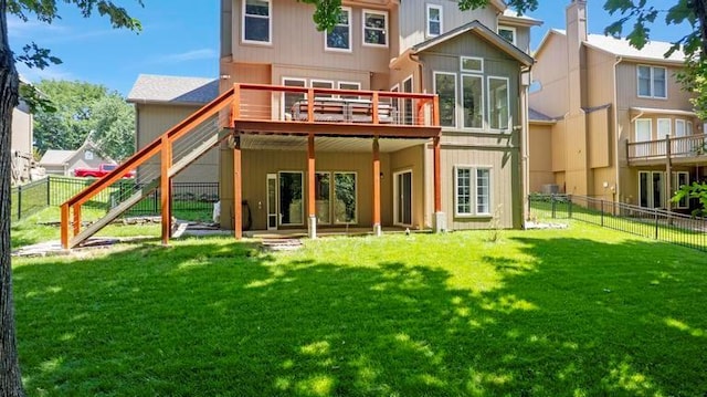 4612 Roberts St, Shawnee, KS 66226 - back of property with a wooden deck and a fenced backyard