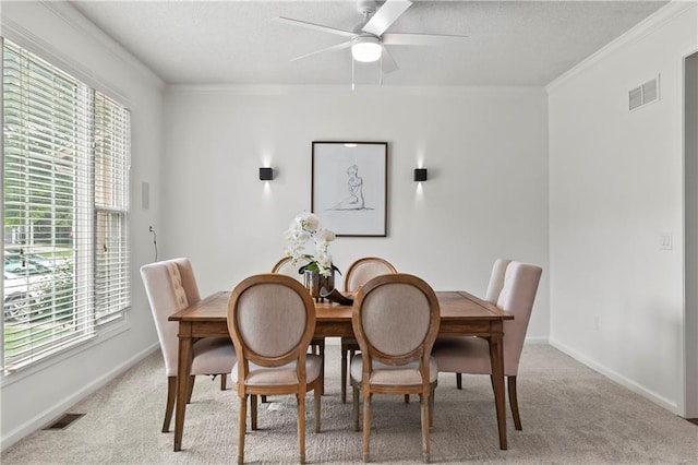 4612 Roberts St, Shawnee, KS 66226 - dining area featuring plenty of natural light, light carpet, a ceiling fan, crown molding, and a textured ceiling