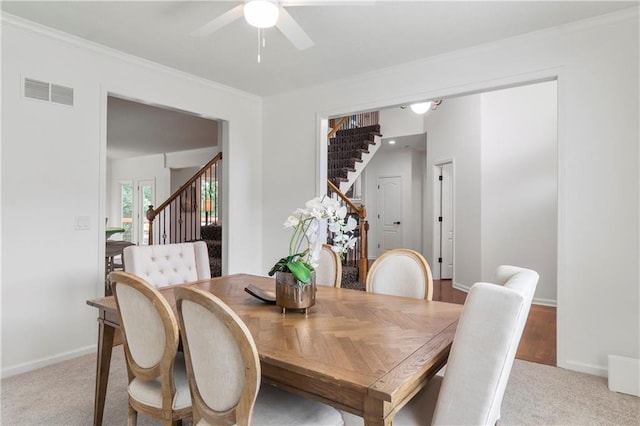 4612 Roberts St, Shawnee, KS 66226 - dining area featuring stairs, a ceiling fan, ornamental molding, and light colored carpet