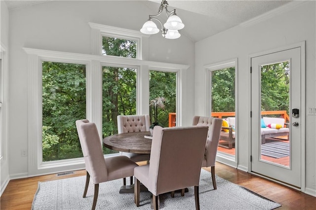 4612 Roberts St, Shawnee, KS 66226 - dining room with a chandelier, lofted ceiling, and healthy amount of natural light