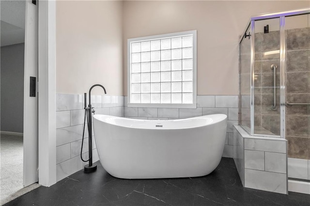 4612 Roberts St, Shawnee, KS 66226 - full bath featuring tile walls, wainscoting, a shower stall, and a freestanding bath