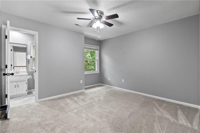 4612 Roberts St, Shawnee, KS 66226 - unfurnished room featuring ceiling fan, light carpet, and a textured ceiling
