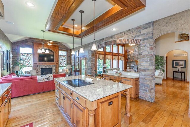 26650 W 100th Pl, Olathe, KS 66061 - kitchen featuring black electric cooktop, light wood-style flooring, and plenty of natural light