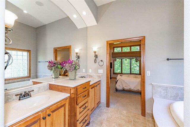 26650 W 100th Pl, Olathe, KS 66061 - bathroom with vanity, ensuite bath, a garden tub, and recessed lighting