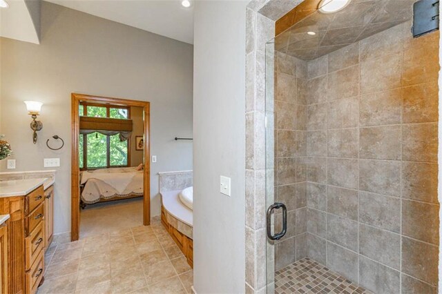 26650 W 100th Pl, Olathe, KS 66061 - ensuite bathroom with a shower stall, vanity, a garden tub, recessed lighting, and tile patterned floors
