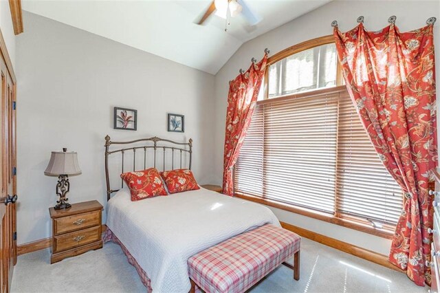 26650 W 100th Pl, Olathe, KS 66061 - carpeted bedroom with baseboards, vaulted ceiling, and a ceiling fan