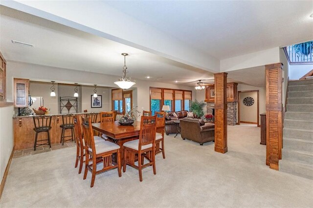 26650 W 100th Pl, Olathe, KS 66061 - dining area with stairs, light carpet, a ceiling fan, and baseboards