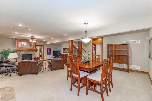 26650 W 100th Pl, Olathe, KS 66061 - dining area featuring light carpet, ceiling fan, recessed lighting, a stone fireplace, and baseboards