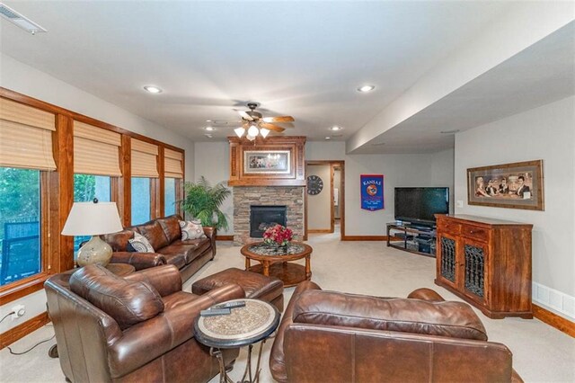 26650 W 100th Pl, Olathe, KS 66061 - carpeted living room featuring baseboards, a ceiling fan, a fireplace, and recessed lighting