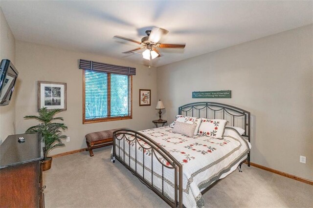 26650 W 100th Pl, Olathe, KS 66061 - carpeted bedroom with baseboards and ceiling fan