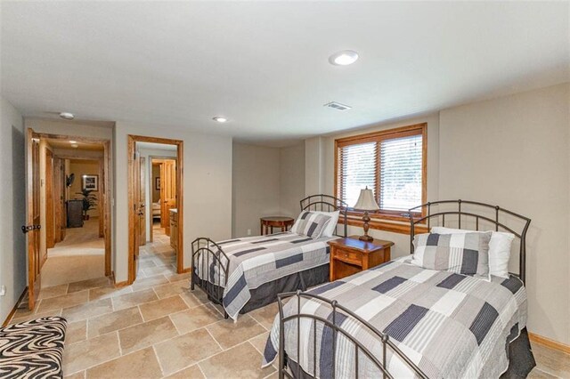 26650 W 100th Pl, Olathe, KS 66061 - bedroom with baseboards, recessed lighting, and light stone finish flooring
