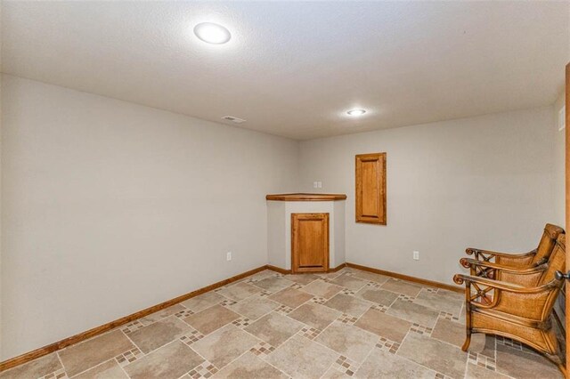 26650 W 100th Pl, Olathe, KS 66061 - unfurnished room with baseboards, light stone finish floors, and recessed lighting